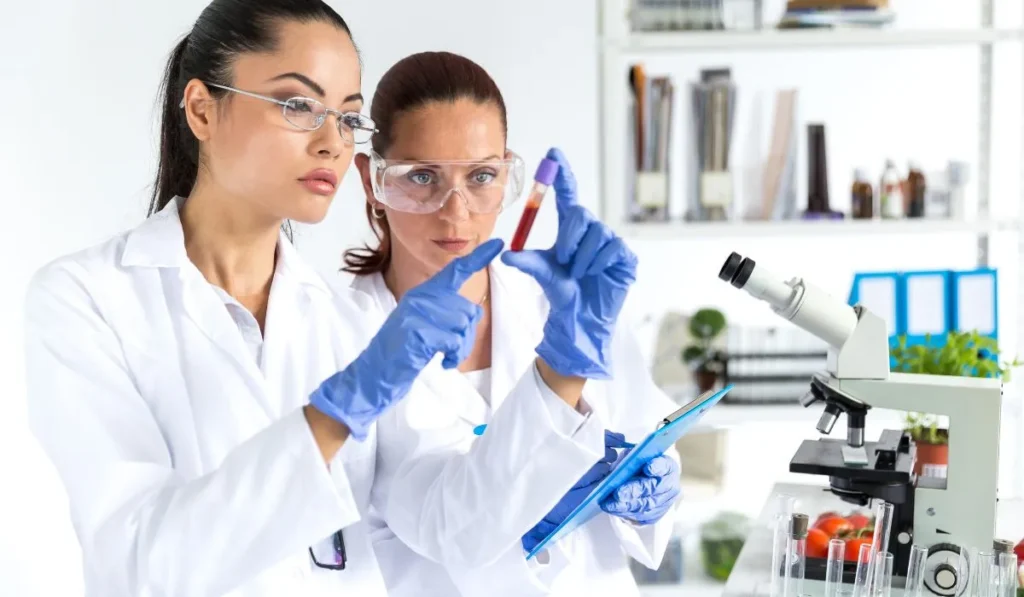 two women checking blood samples - Lynk Diagnostics two women checking blood samples