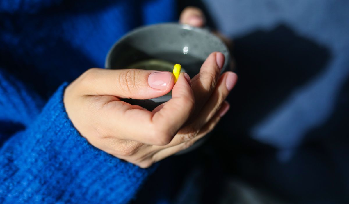 person taking a pill 1