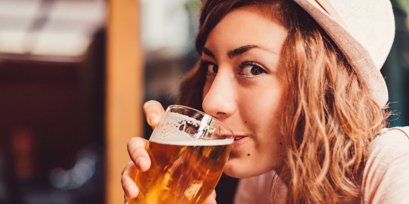 woman drinking a beer